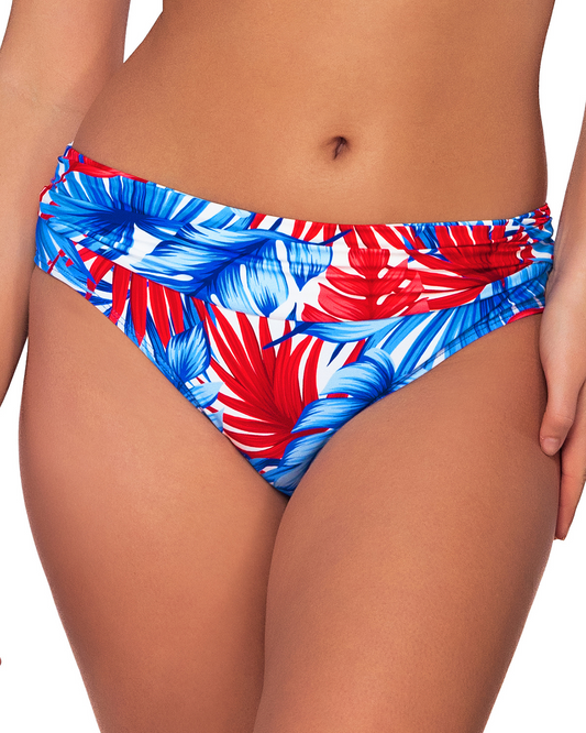 Model wearing a hipster bikini bottom in a red, white and blue palm frond print.