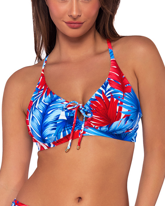 Model wearing a keyhole bikini top with hidden underwire in a red, white and blue palm frond print.