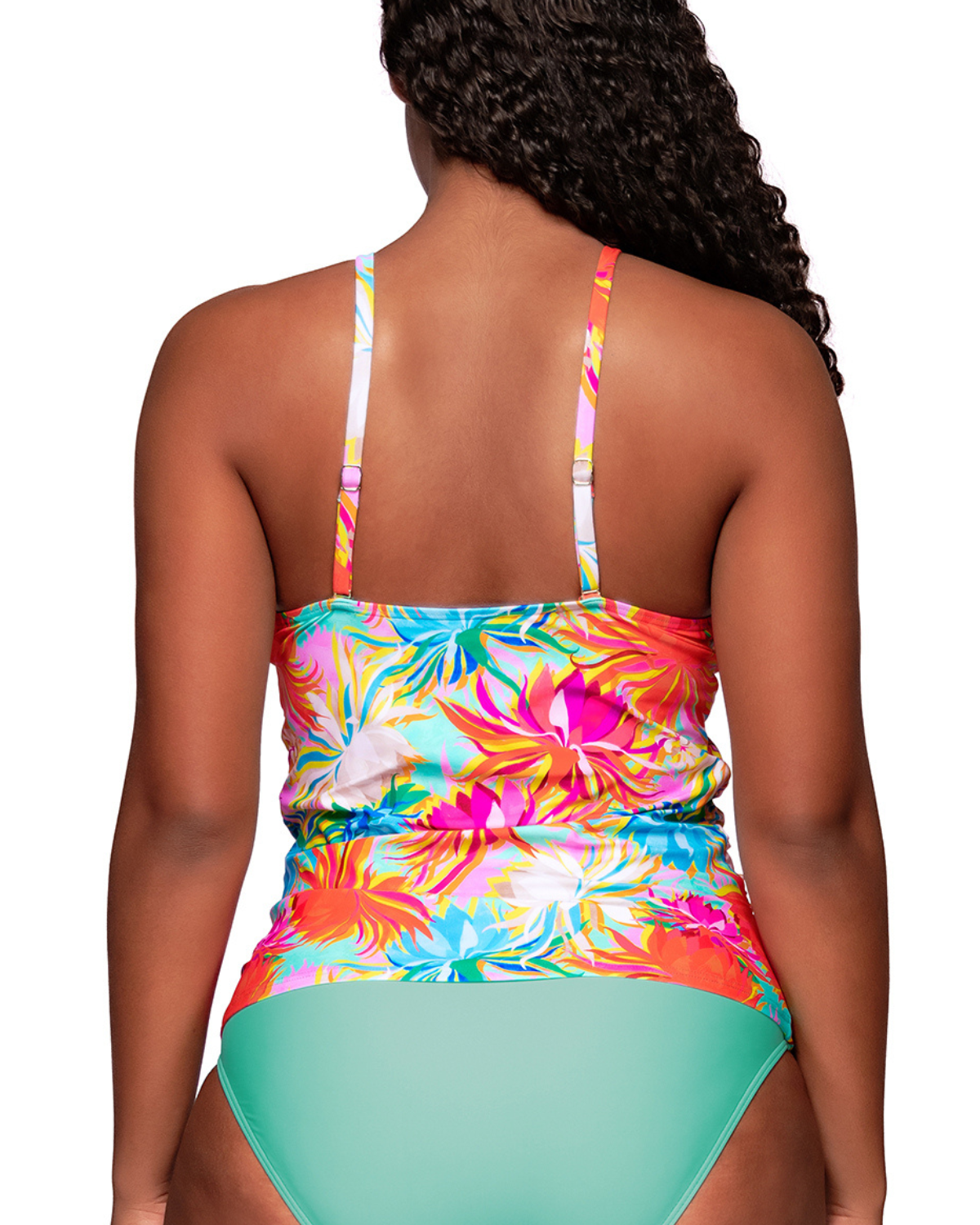 Model wearing a high neck tankini top in an orange, turquoise, white and pink floral print.