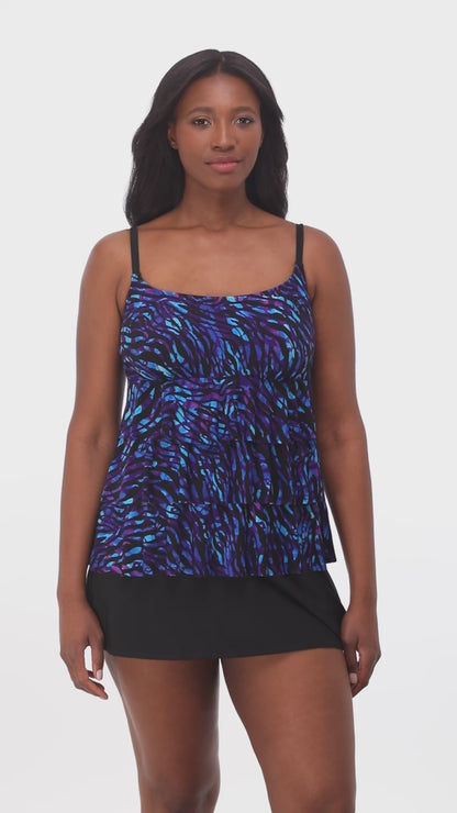 Model turning 360 degrees wearing a faux skirtini with a black skirted bottom and black, purple and blue animal print top.