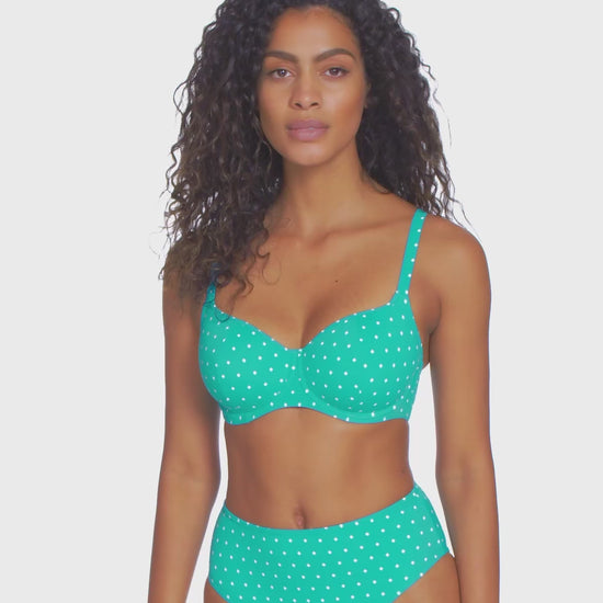 Model turning 360 degrees wearing a underwire sweetheart bikini top in a white dot and turquoise base print