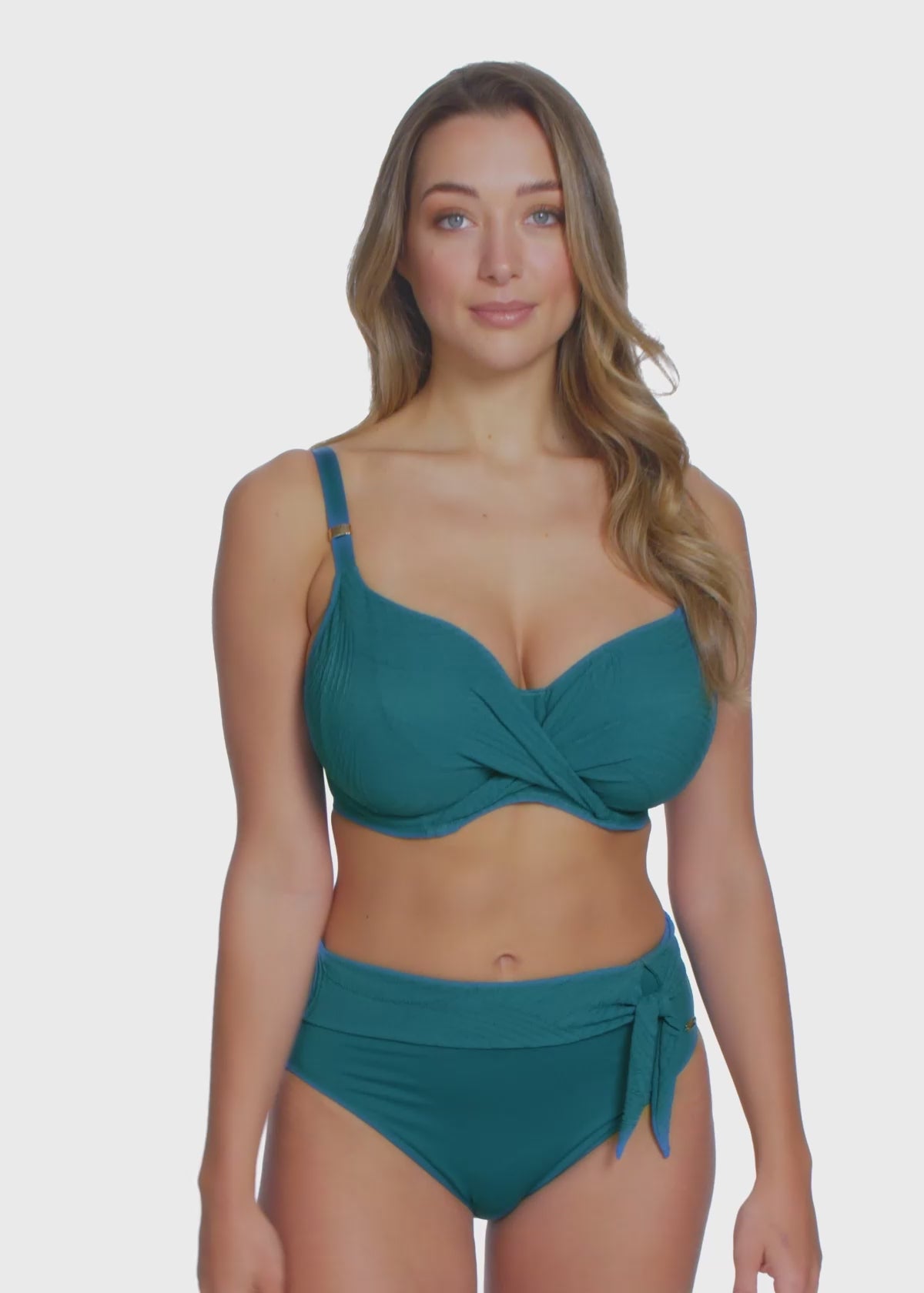 Model turning 360 degrees in an underwire wrap bikini top in blue