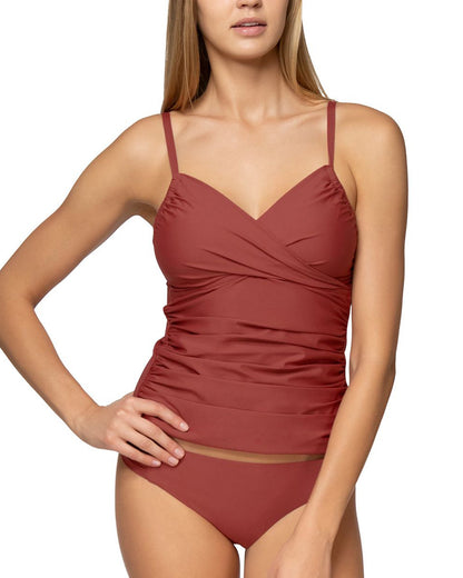 Model on white backdrop wearing a maroon colored tankini top with a sweetheart crossover neckline