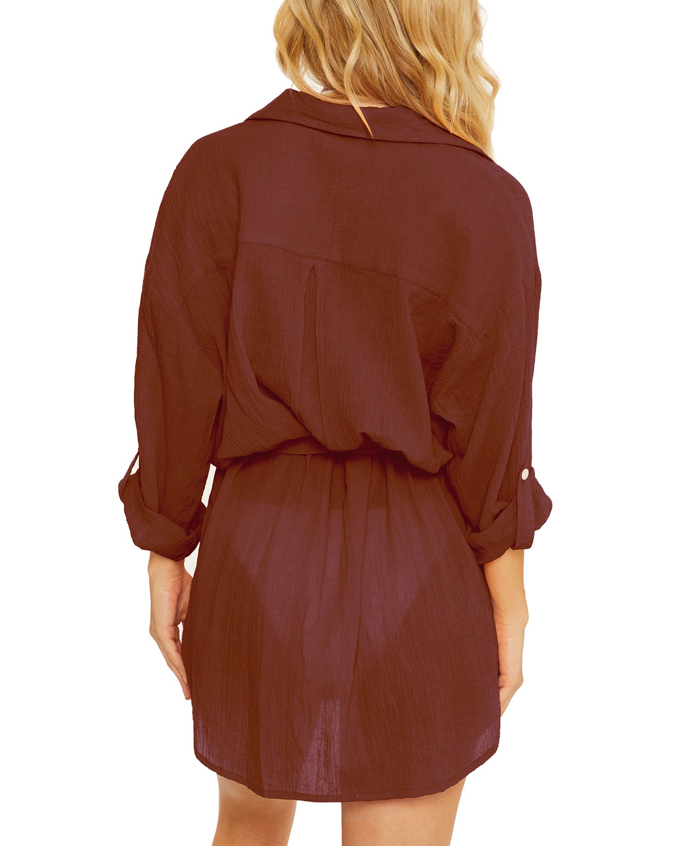 Model wearing a gauzy button up shirt dress in maroon
