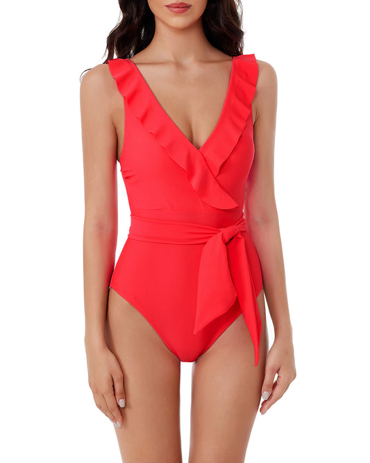 Model wearing a v-neck one piece with ruffle detail and tie waist in red