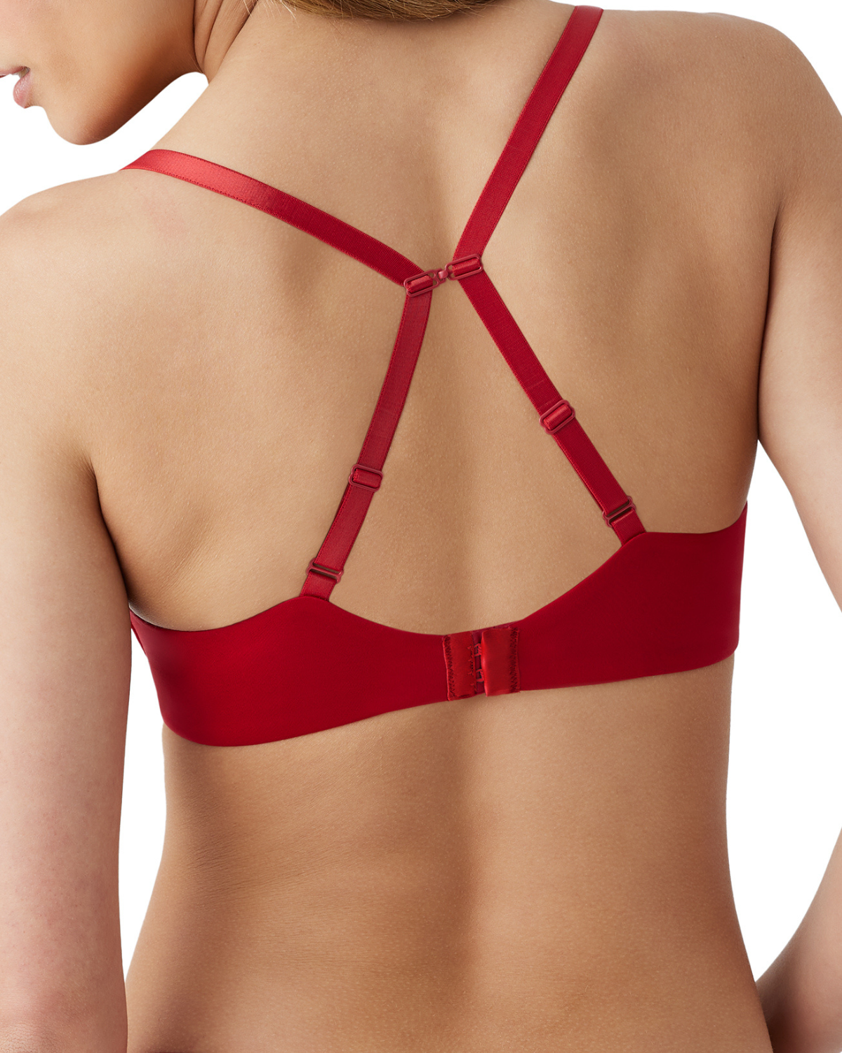 Back view of model on a white backdrop wearing a red underwire t-shirt bra with fully adjustable straps converted into a racerback using a j-hook.