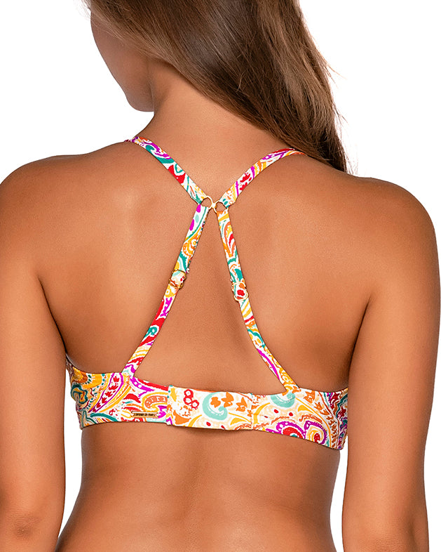 Model wearing a keyhole bikini top with hidden underwire in a white, yellow, red, purple and turquoise paisley print.