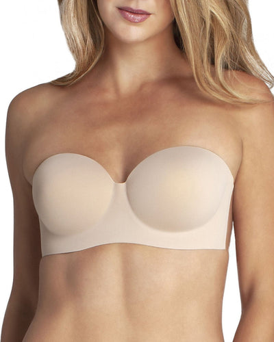 model wearing an adhesive backless strapless nude bra with a sweetheart neckline